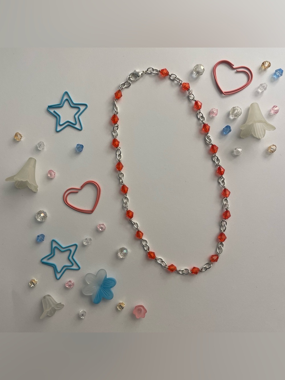 Silver chain necklace with red beads